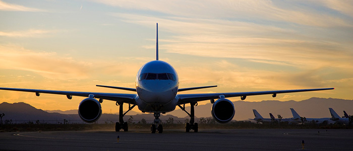 A Fedex plane on the runway at dusk