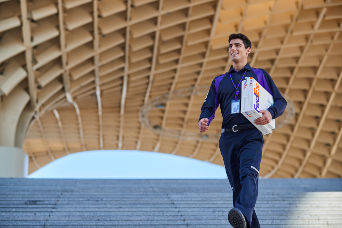 FedEx employee with package
