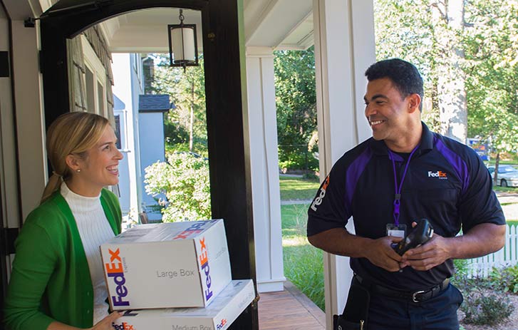 Woman receiving delivery at home