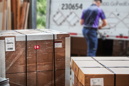 FedEx Express Freight employee talking with customer