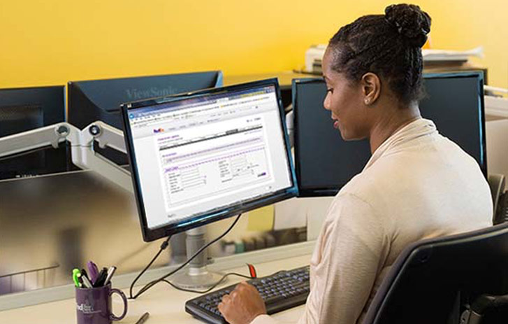 woman on computer at desk