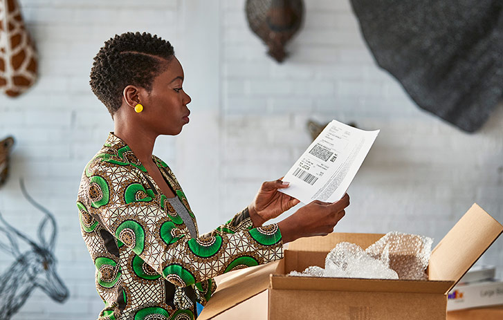 Woman looking at shipping label