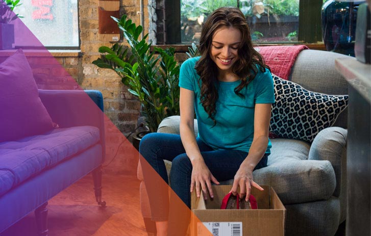 FedEx employee holding box